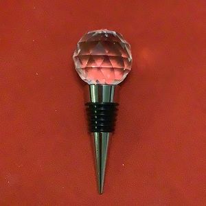 Cristal like wine finial has a black Ring around the middle . Made. By Durand.